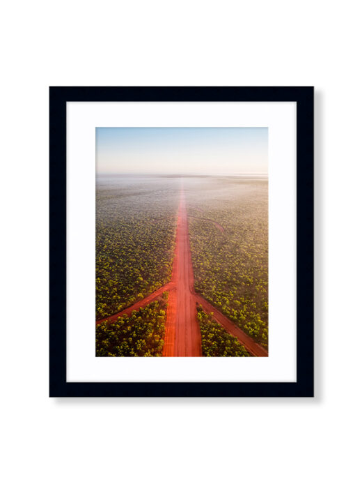 An Aerial Drone Photo of The Red Dirt Road at Sunrise in Broome Western Australia. Available as a Fine Art Framed Photo Print.