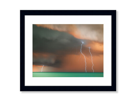 A Sunset Storm Photo of Lightning off Cable Beach in Broome Western Australia. Available as a fine art framed photo print.