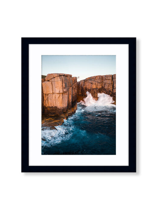 An Aerial Drone Photo of Sunset at The Gap and Natural Bridge in Albany Western Australia. Available as a fine art framed photo print.