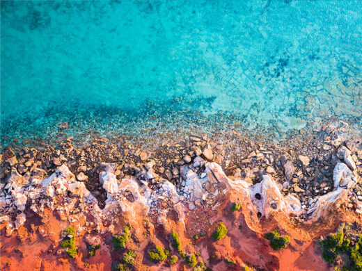Gantheaume Point aerial drone photo red cliffs in broome western australia from miles away matt deakin available to buy fine art framed or canvas print