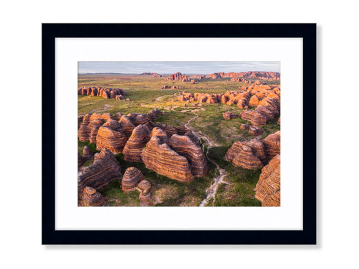 An Aerial Drone Photo during sunrise of the Bungle Bungles in Purnululu National Park, Western Australia. Available as a Fine Art Framed Photo Print.