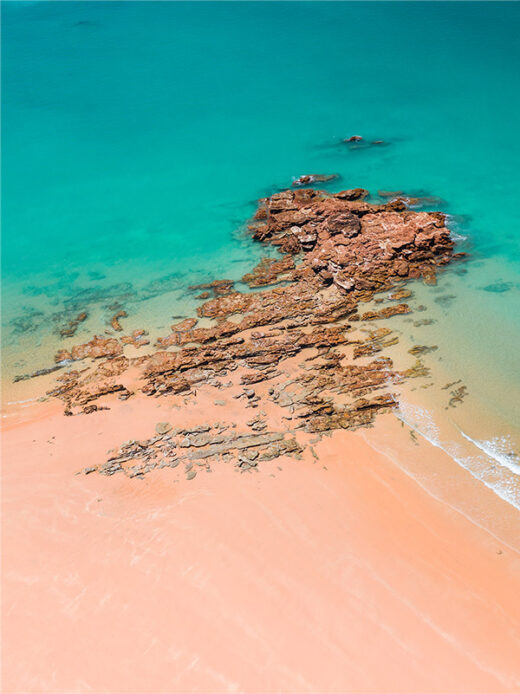 Entrance Point Reef with Blue Water and Orange Sand Beach.